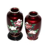 A pair of cloisonne red enamel floral vases with modern stands