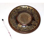 A Victorian circular brass inkstand dish, with pen; and a porcelain panel depicting three figures,