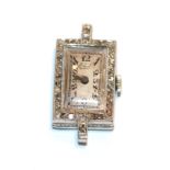 A watch face with diamond set bezel, stamped 'PLATINE'