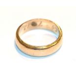 A band ring stamped '18K', finger size S. Gross weight 9.3 grams.