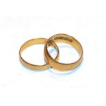 Two 22 carat gold band rings, finger sizes M. Gross weight 6.65 grams.