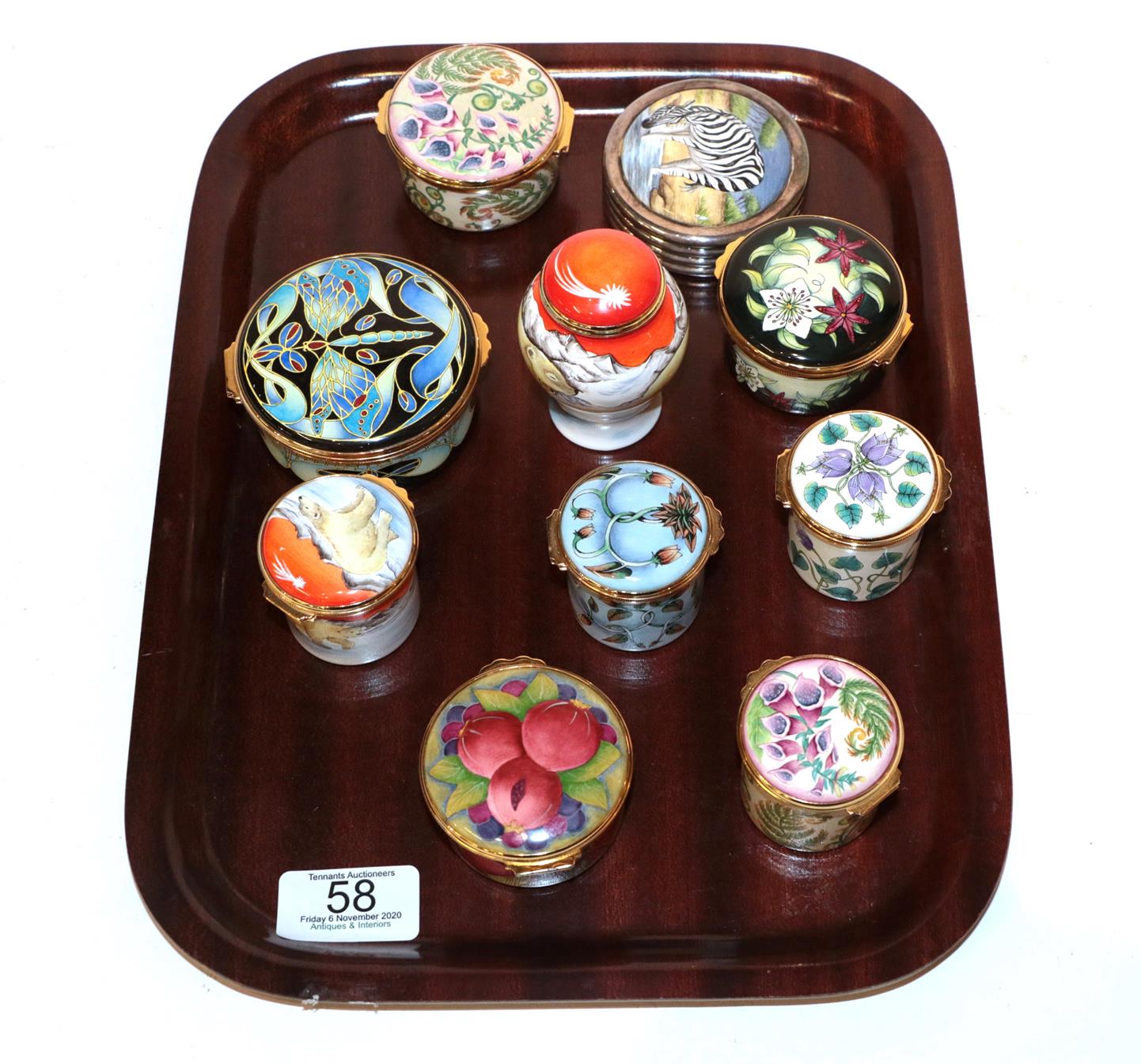 A collection of Moorcroft enamel boxes (10). All first quality. One of the box lids with one minor