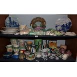 Two shelves of various ceramics including Sylvac and other wall pockets, Villeroy and Boch plates,