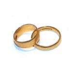 Two 22 carat gold band rings, finger sizes H and O . Gross weight 9.63 grams.