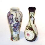 A Moorcroft 'Yorkshire' pattern vase with another (2). Both first quality. Purple flower vase - with