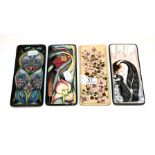 Four various Moorcroft pen trays . All first quality. 20cm by 8.5cm (x3), 20.5cm by 9cm. Three