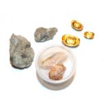 Four gold matrix stones; and a set of three Chinese ingots