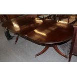 A Regency style mahogany twin-pedestal extending dining table, with two additional leaves, 254cm (