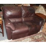 A brown two-seater leather sofa