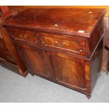 A George IV mahogany side cabinet with a two-as-one drawer over cupboard doors, 99cm by 43cm by 94cm