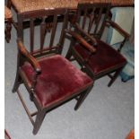 A pair of late George III mahogany armchairs