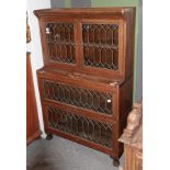 An early 20th century leaded glazed sectional bookcase