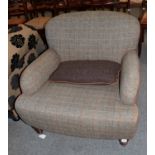 A modern armchair upholstered in Harris tweet, retailed by John Lewis, 91cm by 94cm by 80cm high