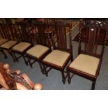 A late 19th century American style rocking chairs; a pair of Chippendale style dining chairs; and