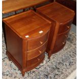 A pair of reproduction cherry wood three-drawer chests, labelled Wills & Gambier