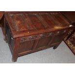 An early 18th century joined oak chest with panelled lid, 114cm by 53cm by 71cm