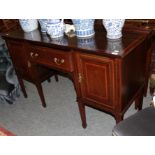 An Edwardian mahogany and satinwood banded sideboard on square tapering legs