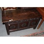 An 18th century carved oak chest with later hinged lid, 107cm by 46cm by 80cm high