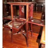 An Edwardian mahogany and satinwood banded occasional table/plant stand, with folding shelves,