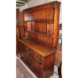 A reproduction oak Welsh dresser, 138cm by 46cm by 187cm high