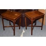 A pair of reproduction Chippendale style mahogany lamp tables, label attached to underside made by