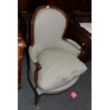 A 19th century French walnut framed armchair in celadon fabric with squab cushion (legs re-tipped)