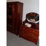 An Edwardian inlaid mahogany single door wardrobe and a matching dressing chest