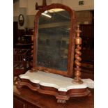 A Victorian mahogany and marble-top serpentine shaped toilet mirror