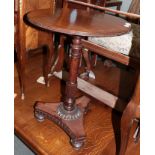 An early 19th century mahogany circular tripod table, with tri-form base and turned feet, 47cm by