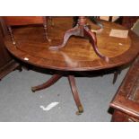 A George III mahogany and crossbanded oval breakfast table, 136cm by 105cm by 70cm