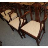 Two similar 19th century mahogany armchairs with matching upholstery; and two further 19th century