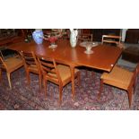 A Mcintosh & Co Ltd teak extending dining table, with two additional leaves, 234cm (extended) 91cm