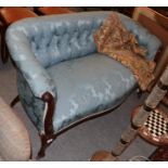 A Victorian mahogany two-seater sofa, upholstered in blue buttoned fabric