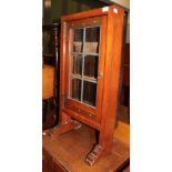 A Victorian mahogany small display cabinet with leaded glass door and sledge feet
