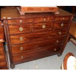 A George IV mahogany straight fronted chest of drawers with an arrangement of six small drawers over