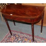 A George IV mahogany D-shaped fold-over card table on turned legs, 92cm by 45cm by 73cm