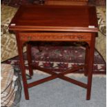 A mahogany blind fret carved fold-over card table, 61cm by 38cm by 71cm high