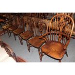 A set of six reproduction Titchmarsh & Goodwin oak wheel-back Windsor chairs, including