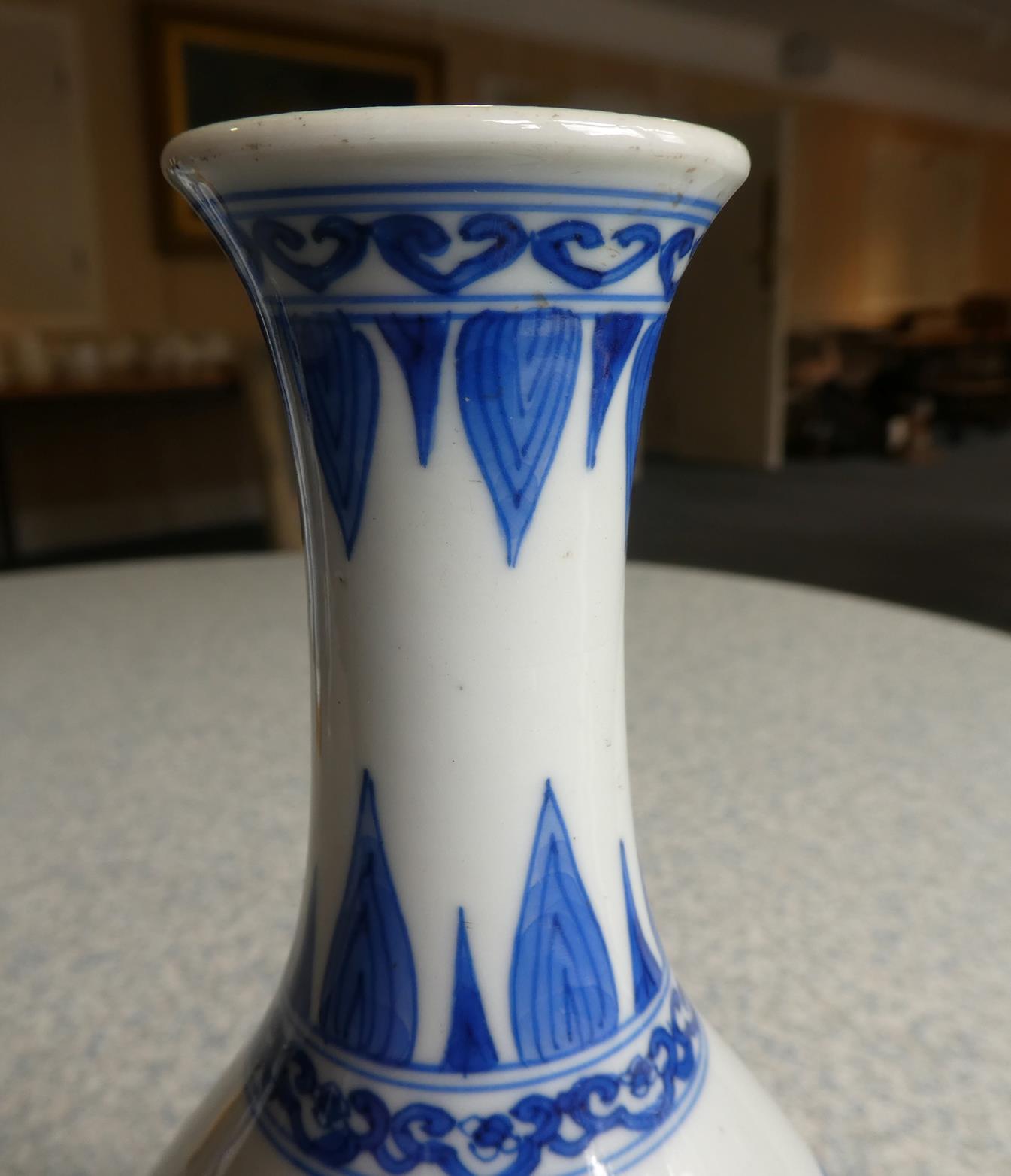 A Pair of Chinese Porcelain Bottle Vases, Kangxi, painted in underglaze blue with scrolls and - Image 11 of 33