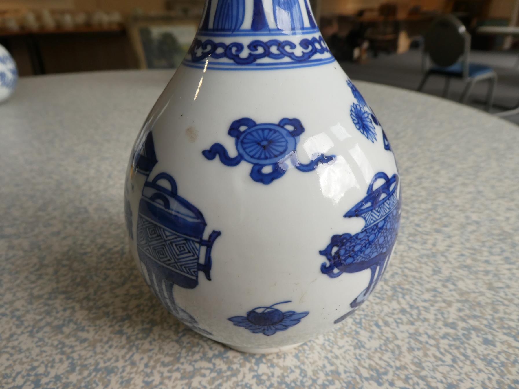 A Pair of Chinese Porcelain Bottle Vases, Kangxi, painted in underglaze blue with scrolls and - Image 21 of 33