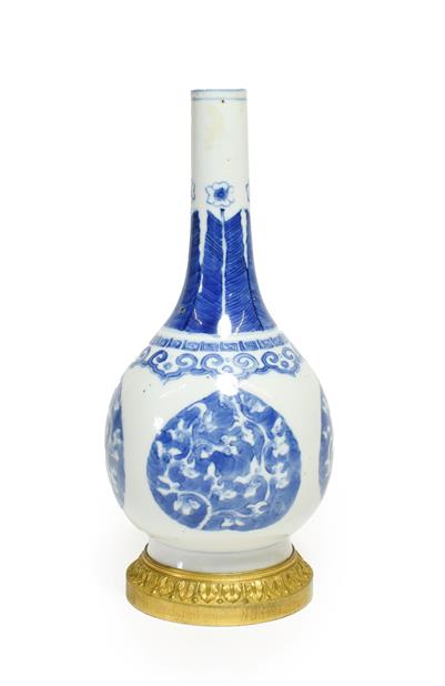 A Gilt Metal Mounted Chinese Porcelain Bottle Vase, the porcelain Kangxi, painted in underglaze blue