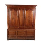 A George III Joined Oak Cupboard, the moulded cornice above three fielded panels and two cupboard