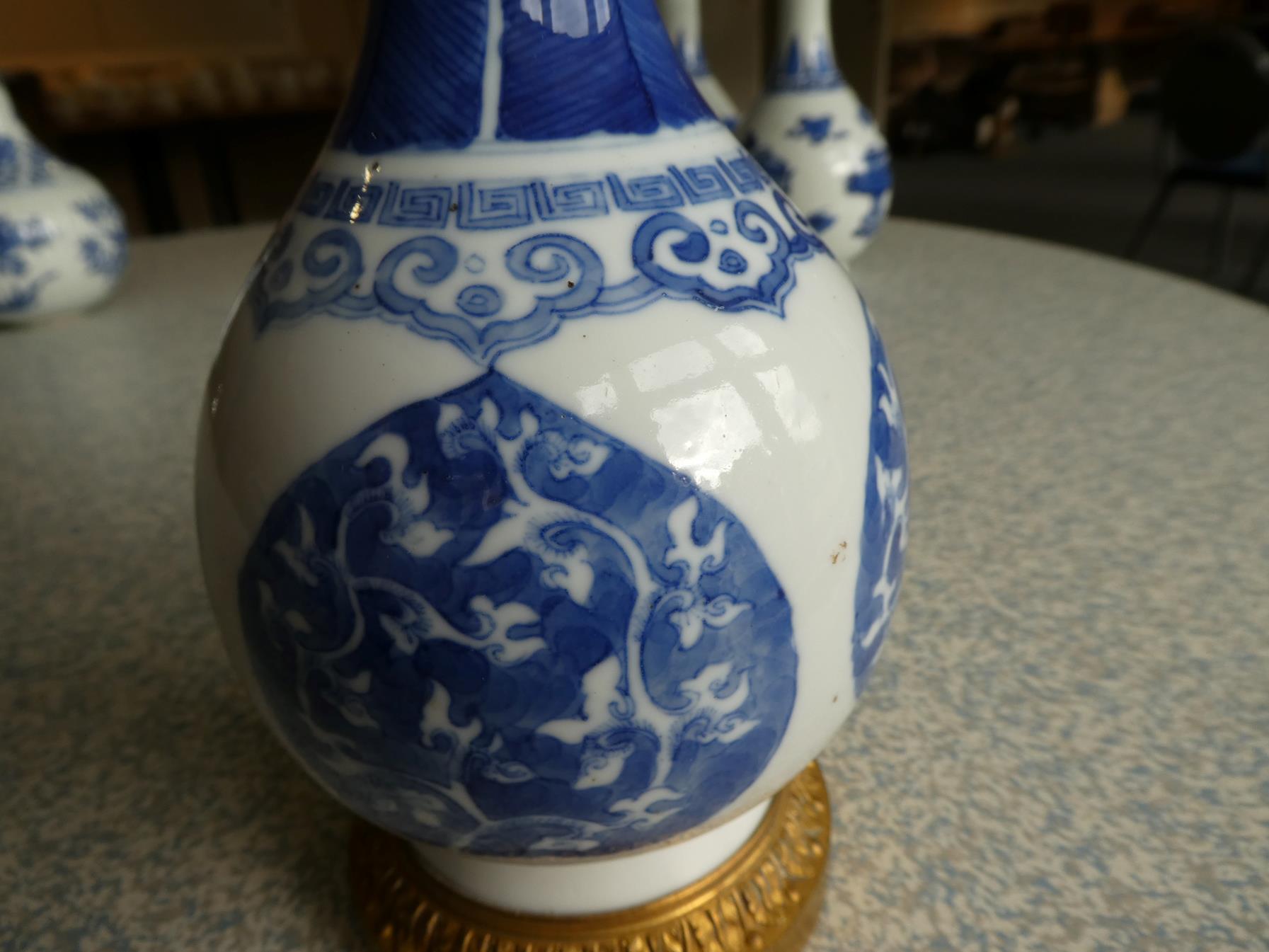 A Gilt Metal Mounted Chinese Porcelain Bottle Vase, the porcelain Kangxi, painted in underglaze blue - Image 6 of 15