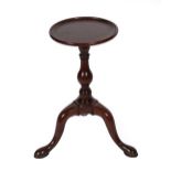 A George III Mahogany Tripod Table, late 18th century, the circular dished top above a vasiform