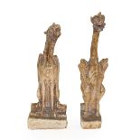 A Pair of Plaster Figures of Grotesque Animals, in Medieval style, each perched with folded wings,