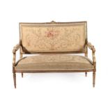 A Late 19th Century French Carved Giltwood Two-Seater Canapé, upholstered in floral Aubusson-type