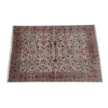 Tabriz Carpet North West Iran, circa 1950 The ivory field of angular vines and palmettes enclosed by