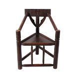 A 19th Century Oak Turner's Chair, of typical triangular form, the carved back support above