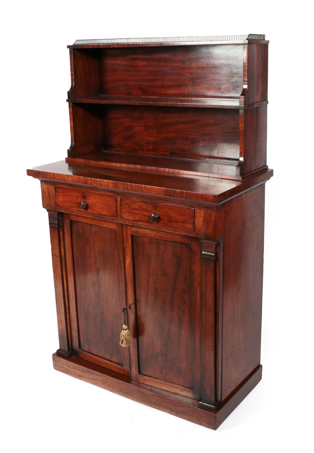 A Mahogany Chiffonier, 2nd quarter 19th century, the upper section with a pierced three-quarter
