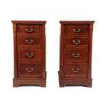 A Pair of Early 20th Century Mahogany Bedside Chests, the moulded tops with parquetry feather-